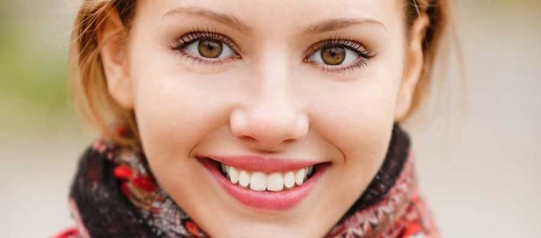 close-up of a pretty womans face smiling